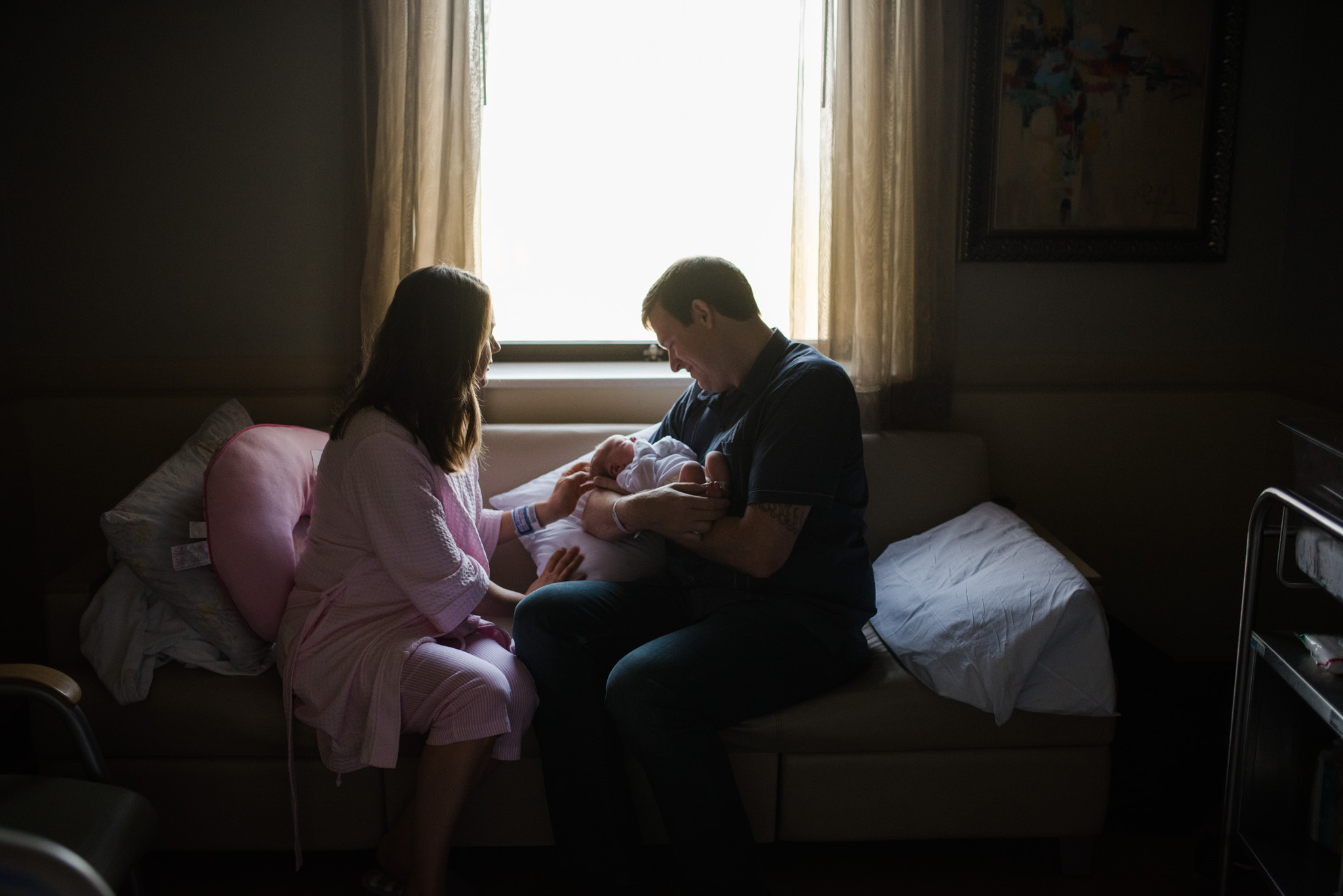 new mom and dad admiring newborn baby girl | Mobile AL Fresh 48 photographer