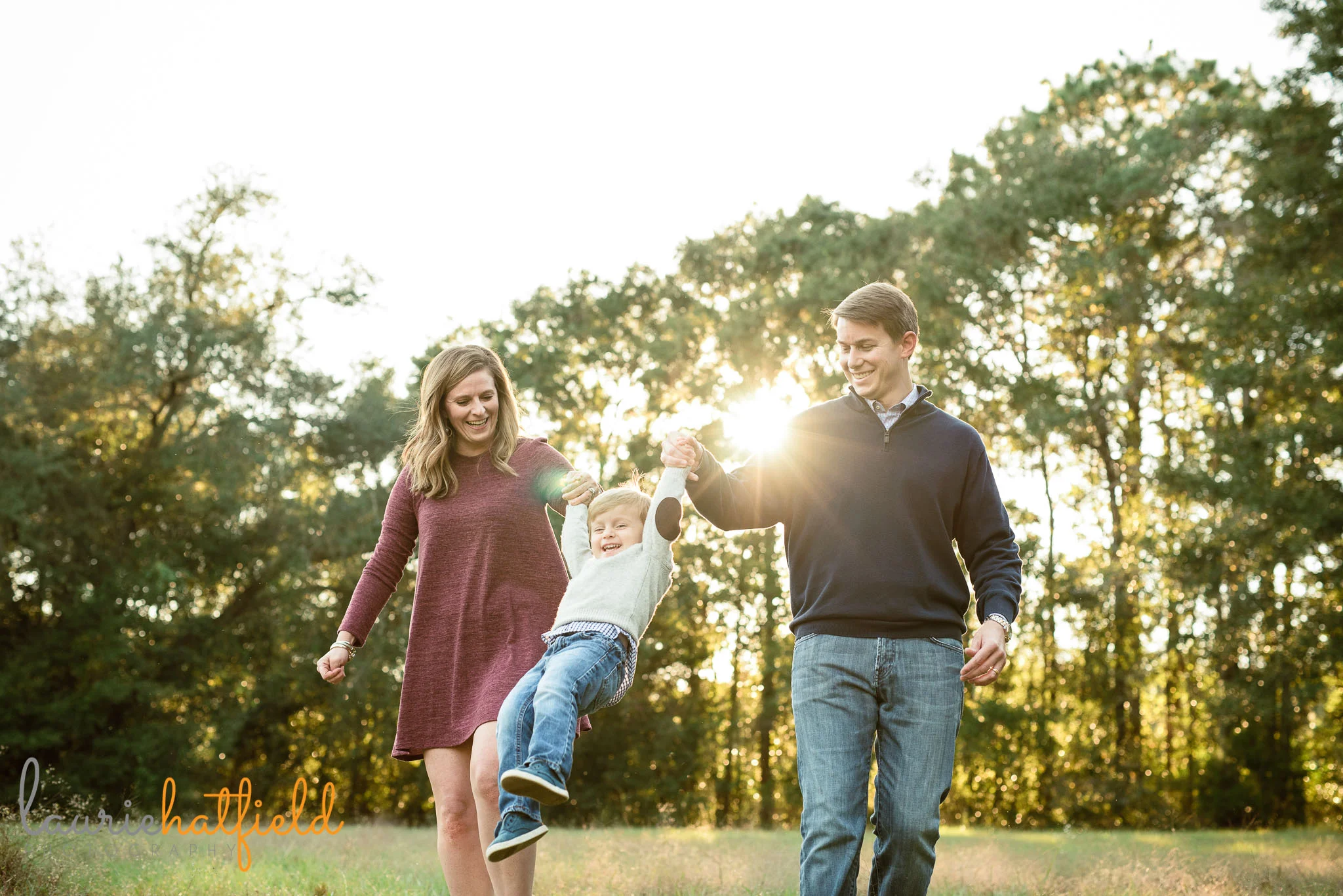 family of 3 playing in field | Mobile AL lifestyle photographer