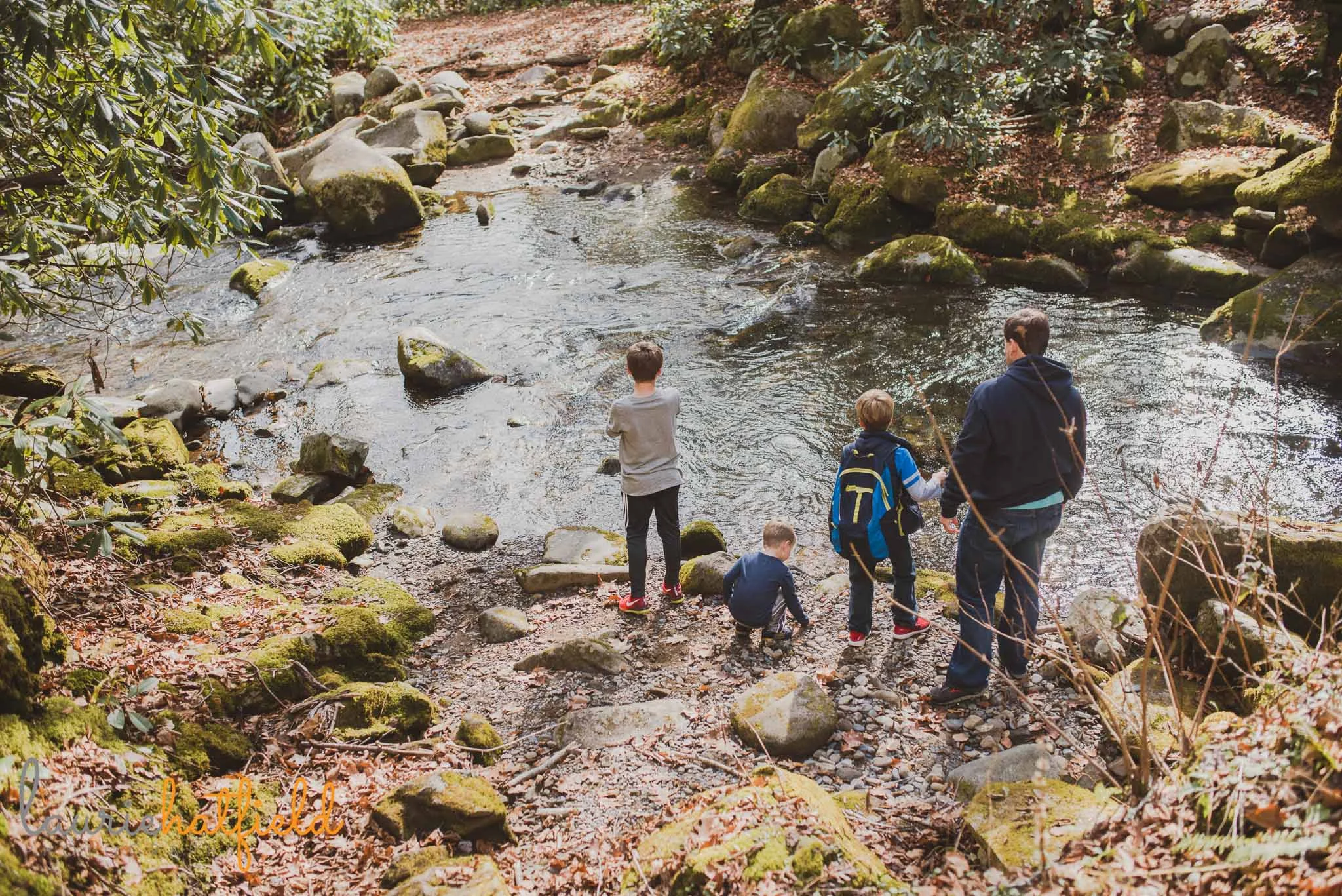 dad and sons playing at creek | Mobile AL family photographer