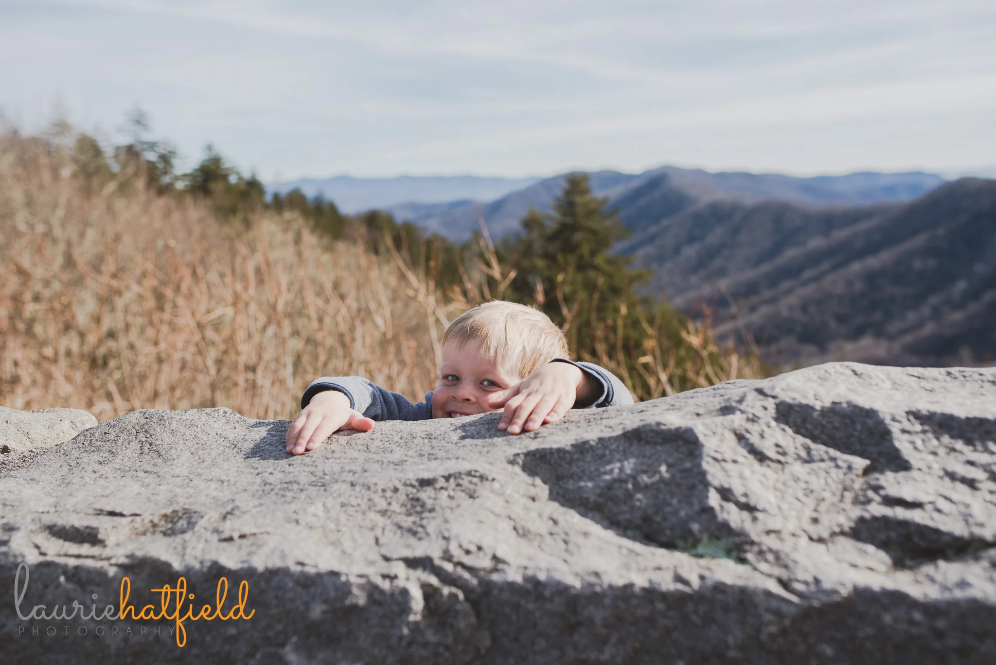 little boy holding onto rock | Mobile AL family photographer