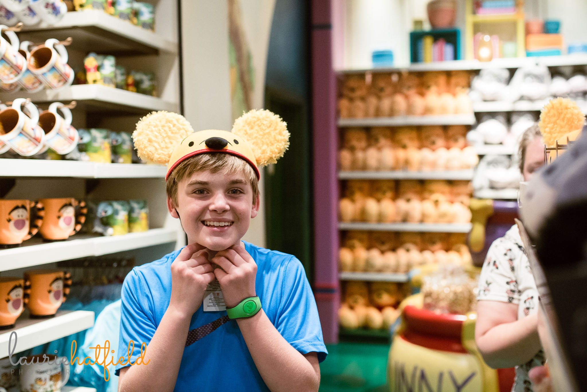 boy trying on Pooh bear hat | Mobile AL family photographer 