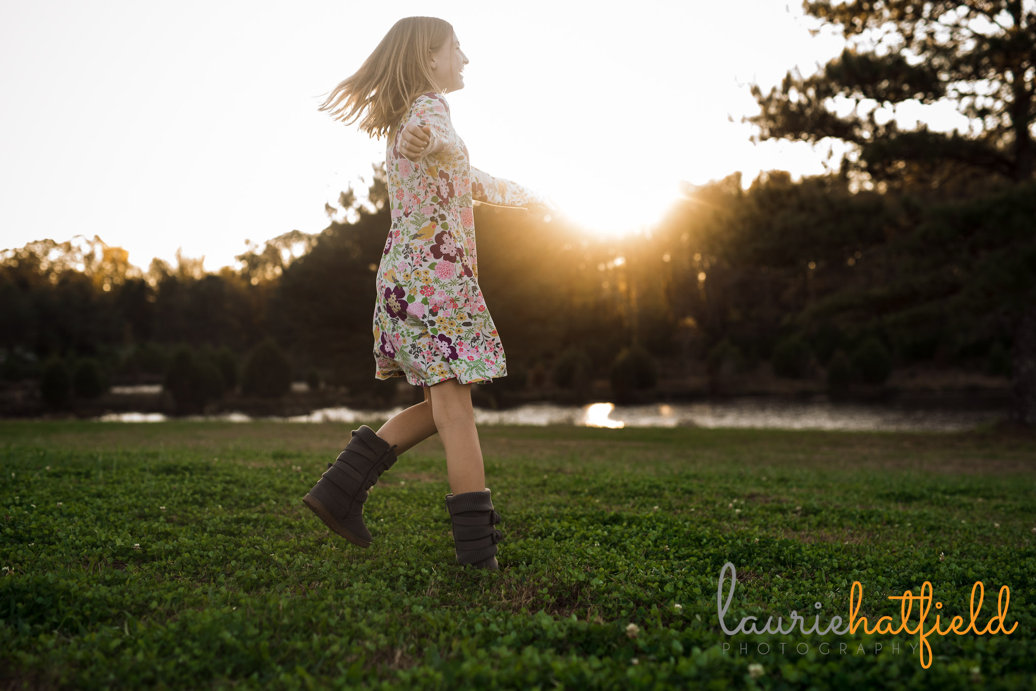 girl twirling in field | Mobile AL family photographer