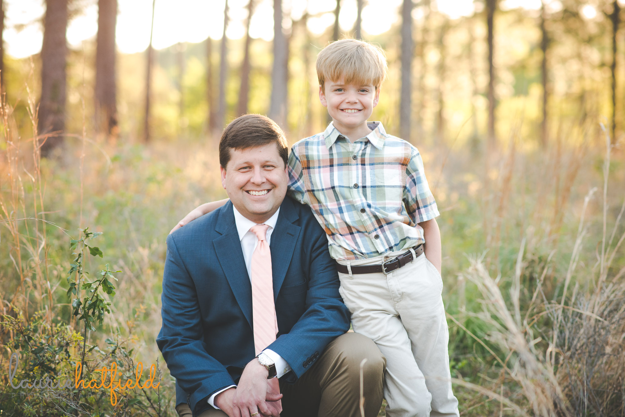 dad with 8-year-old son in field | Mobile AL family photographer