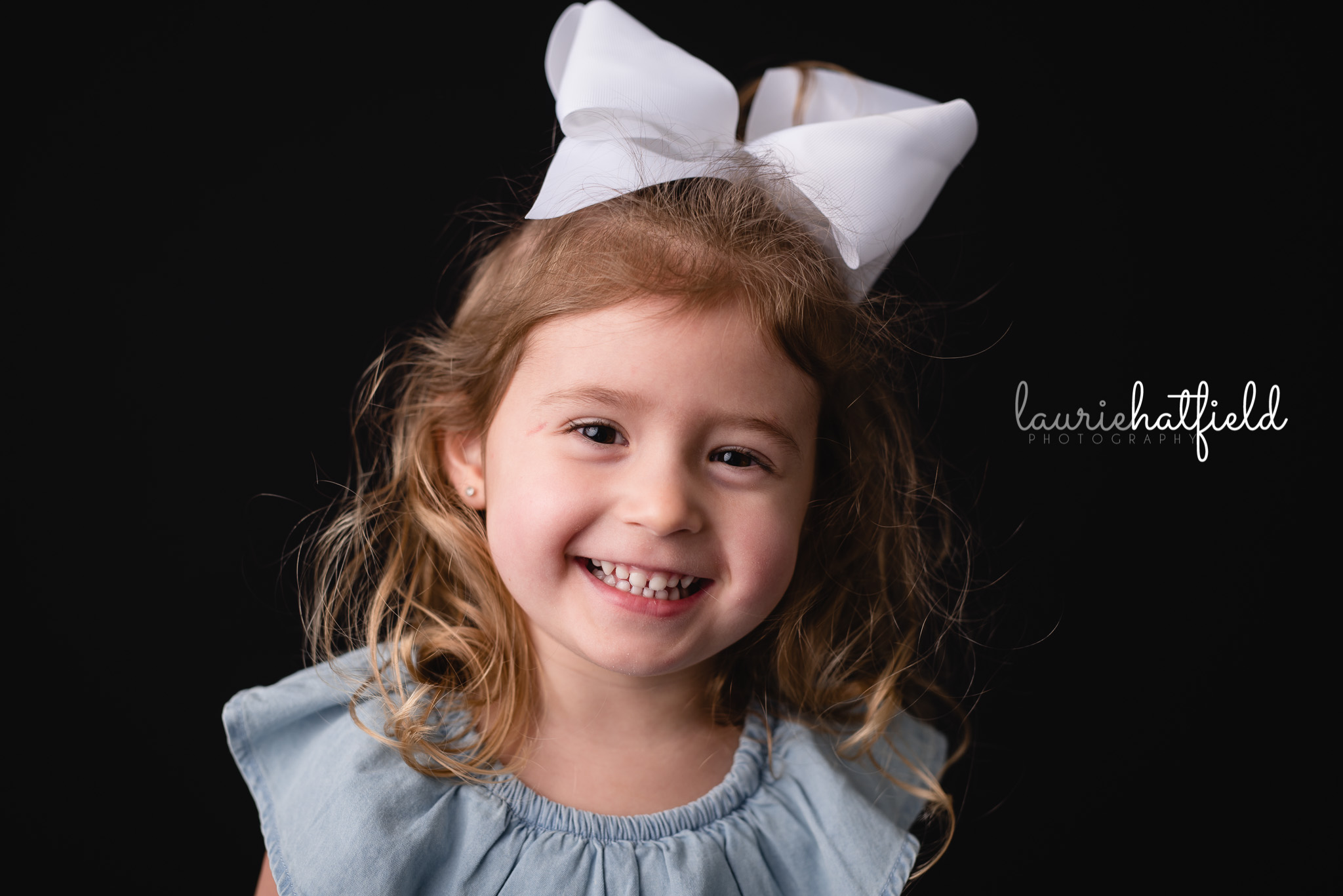 little girl with white bow | Gulf Shores AL school photographer
