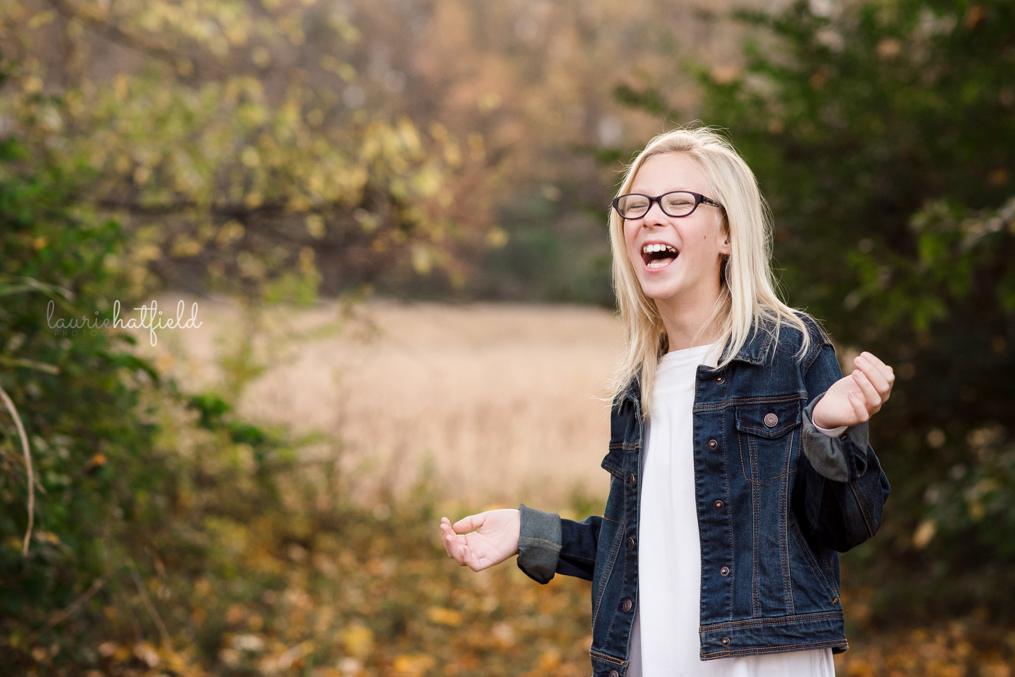 12-year-old girl with blonde hair laughing | Saraland AL family photographer