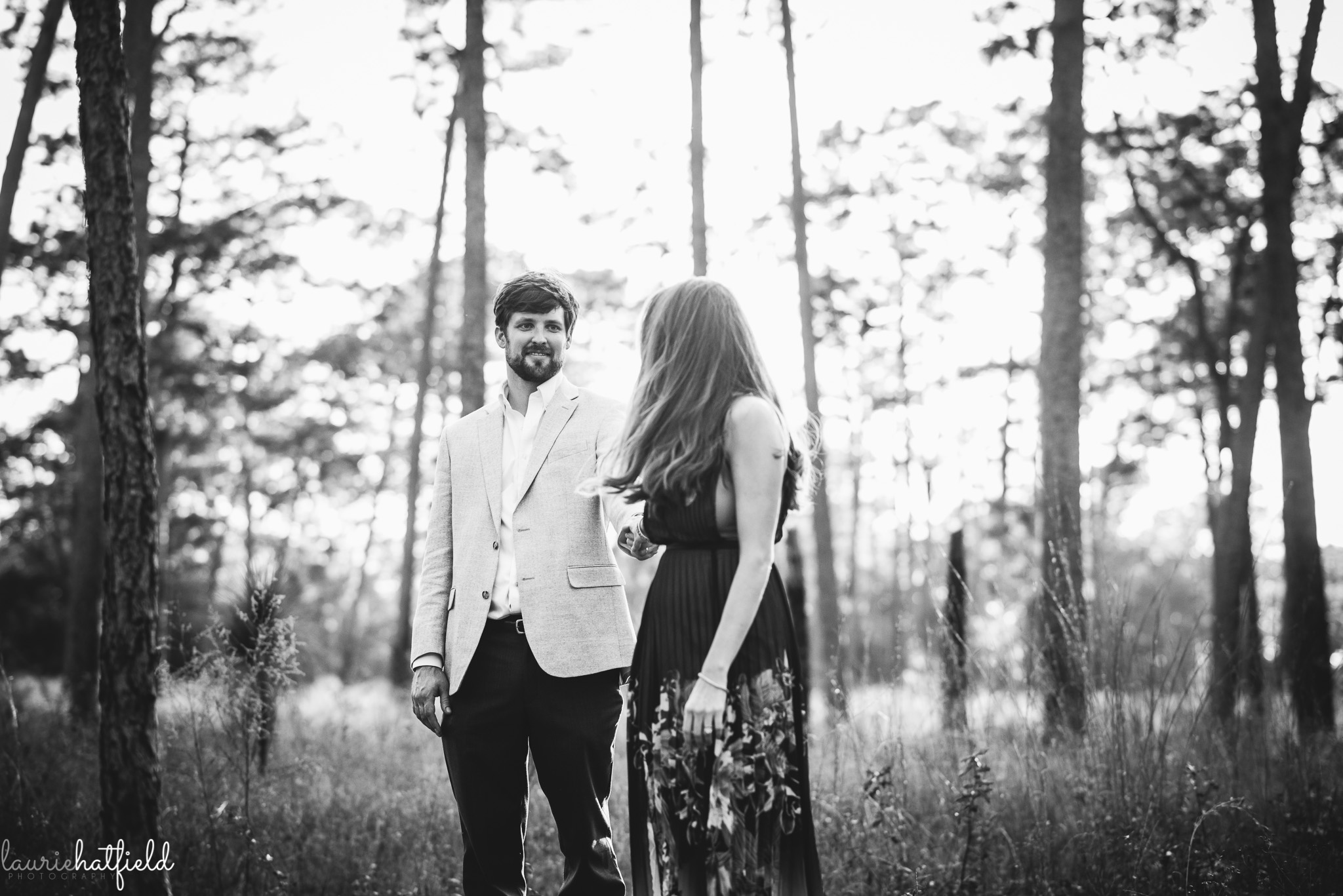couple walking through the woods | Mobile AL family photographer