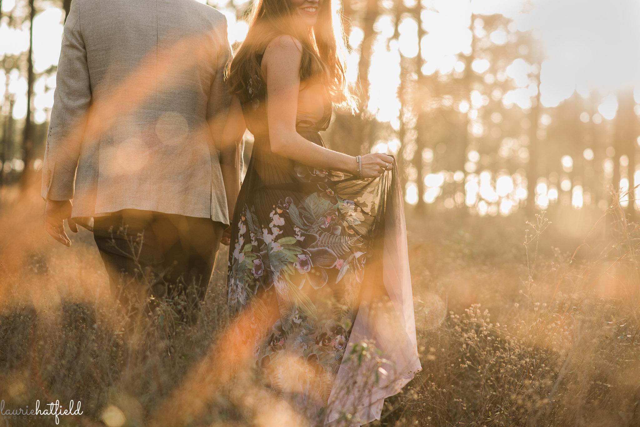 pregnant woman walking through field | Mobile AL maternity photographer