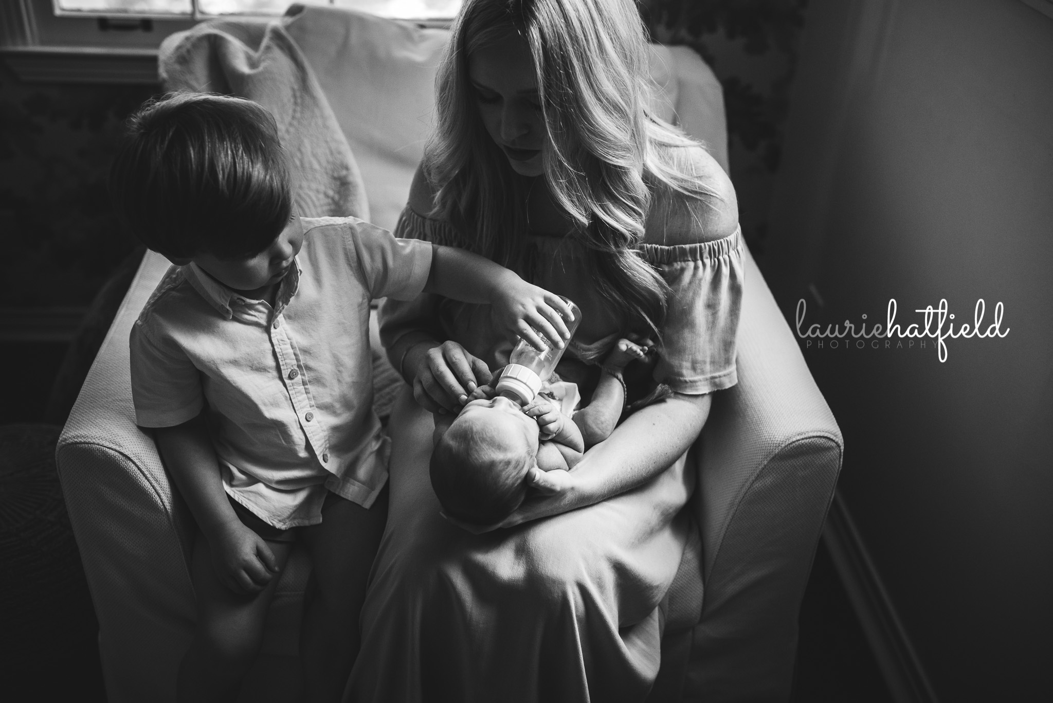 big brother helping feed baby | Mobile AL newborn photographer