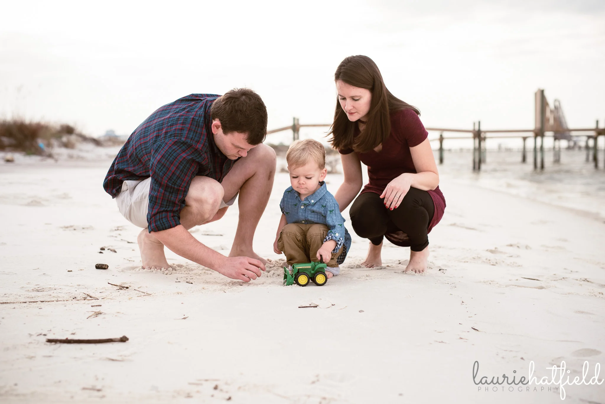 mom, and, and boy playing trucks on the beach | Huntsville Al family photographer