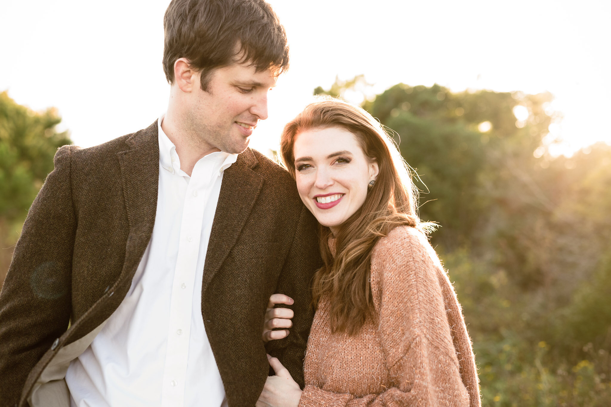 husband smiling down at wife | Madison AL engagement photographer