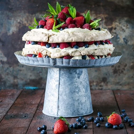 Layered Hazelnut Pavlova with Mascarpone Cream and Berries