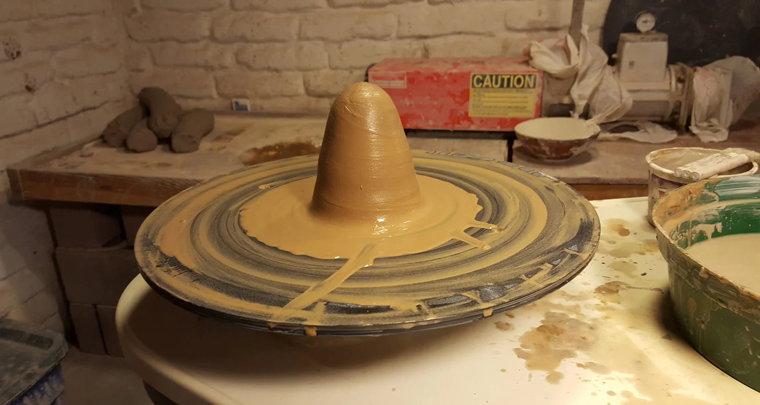 wheel-throwing local clay in New Mexico