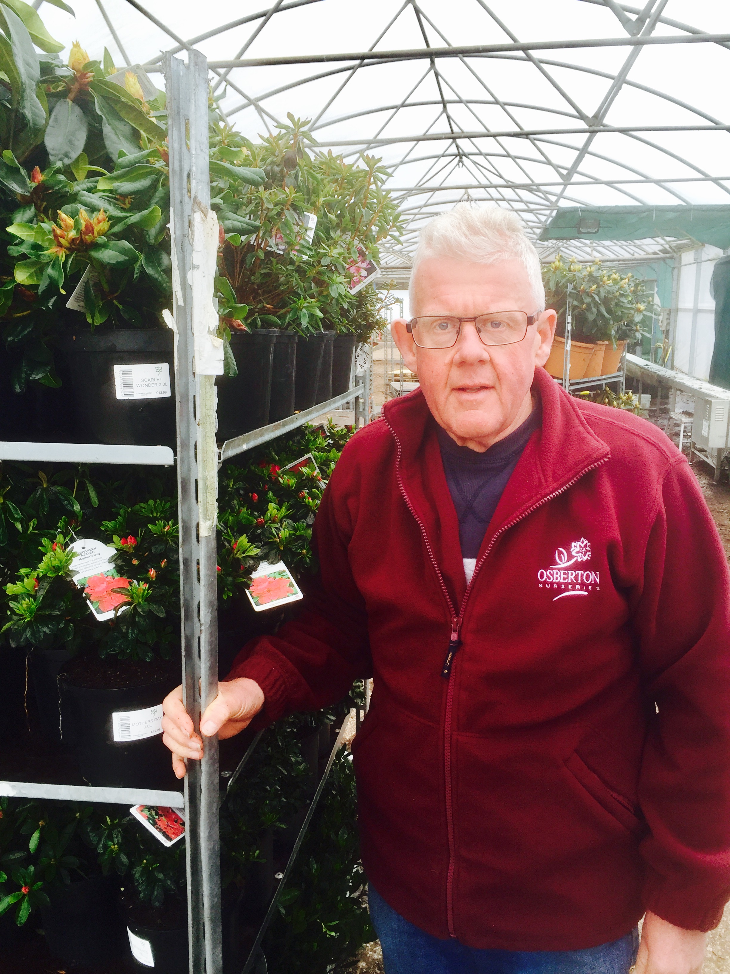 Chris Bowman taking a last look at a trolley of plants before they head out to garden centres across the country.