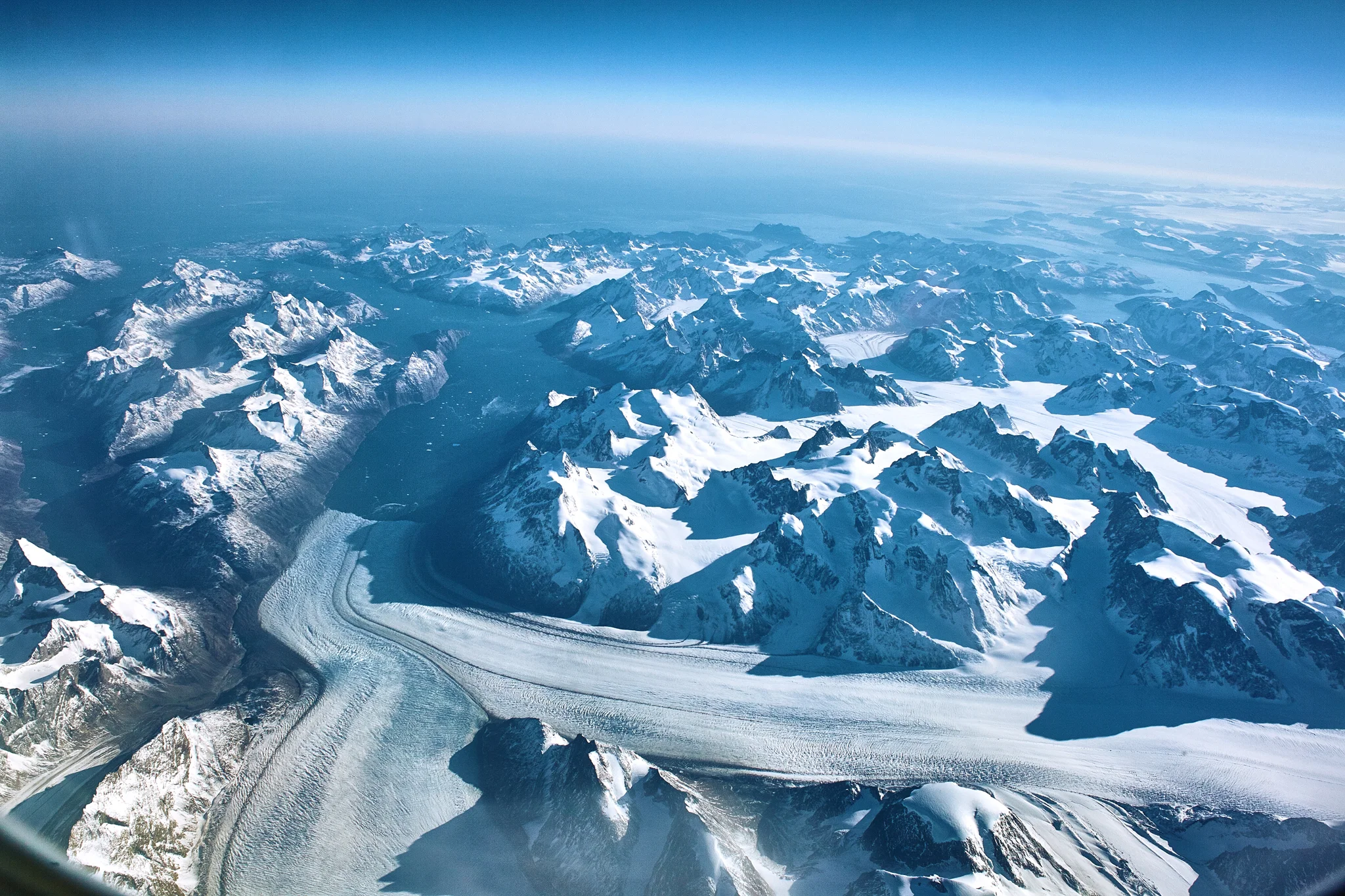 Somewhere very high over Greenland, the curvature of the earth is very visible. 