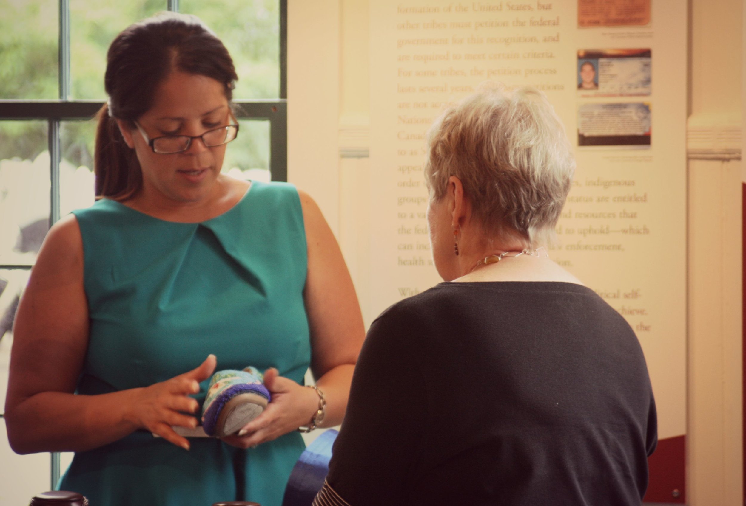 Donna Brown talked about her beaded moccasins with Abbe Trustee, Sandy Wilcox, at the Museum's annual meeting in August.