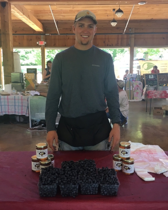 Here's Hunter selling the last of his blueberries for the day.