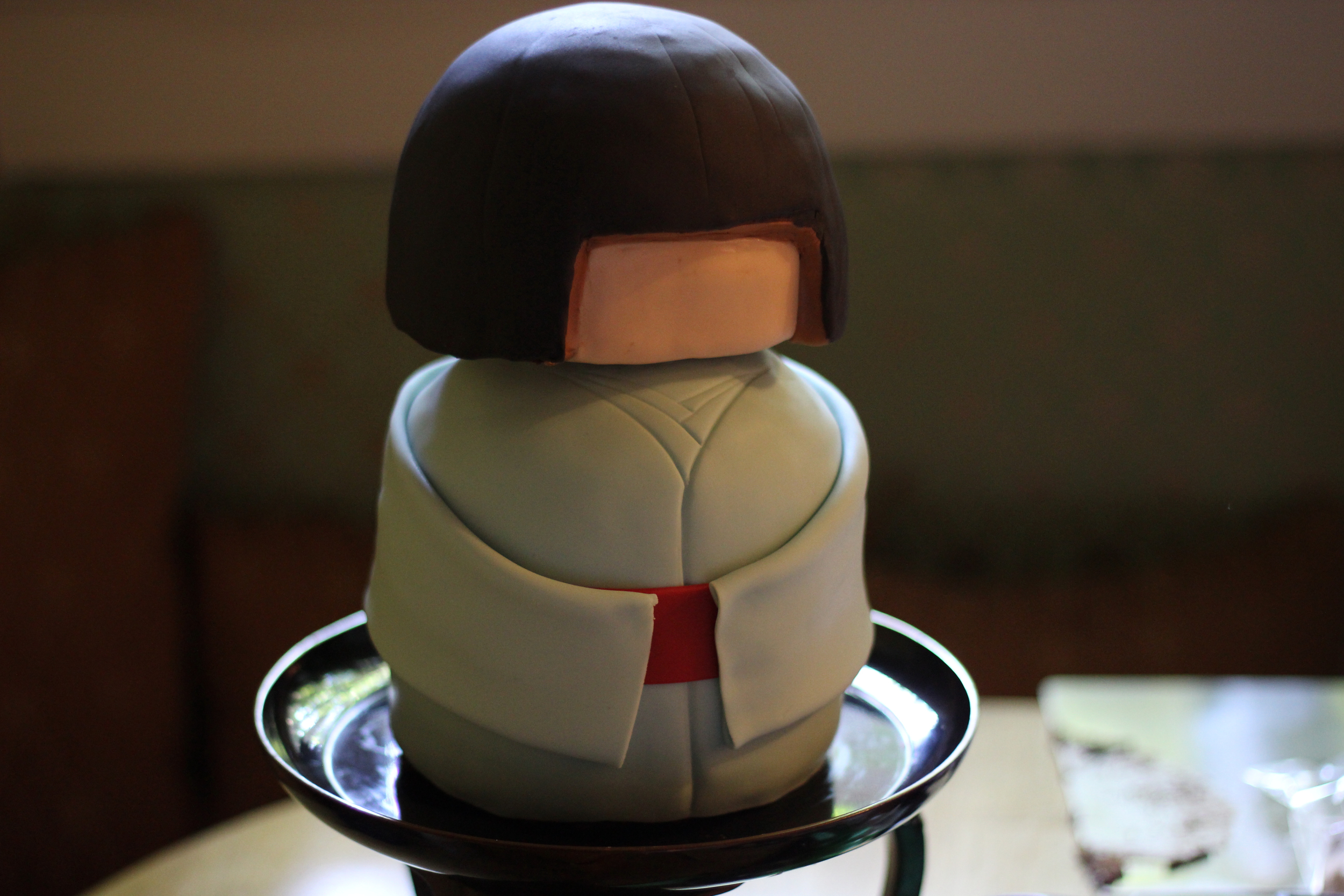awaiting paint. Her hair was shined up with a coat of confectioner's glaze.