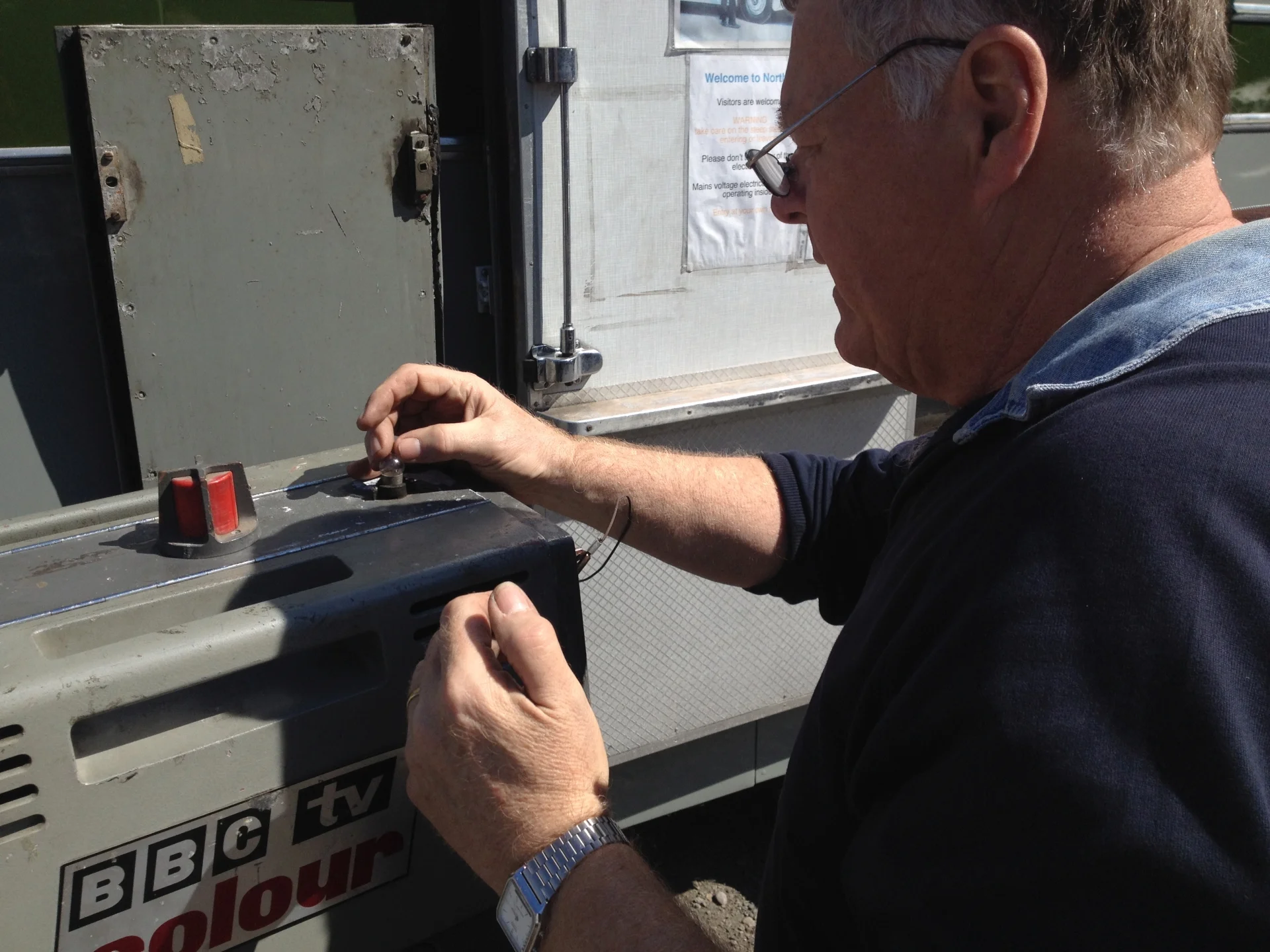 Maintaining communications: Brian Summers replaces the cue light bulb on a vintage Pye PC80 television camera.