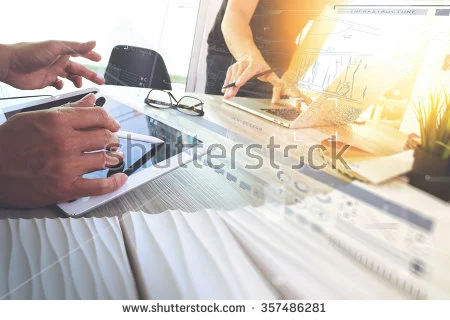 stock-photo-two-colleagues-interior-designer-discussing-data-and-digital-tablet-and-computer-laptop-with-sample-357486281.jpg