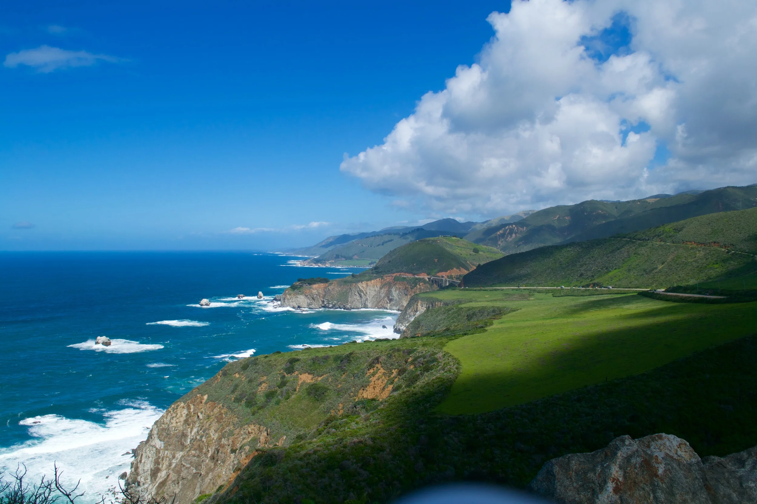 Nope, this is not a Windows background. This is a picture of Big Sur taken by yours truly! :)
