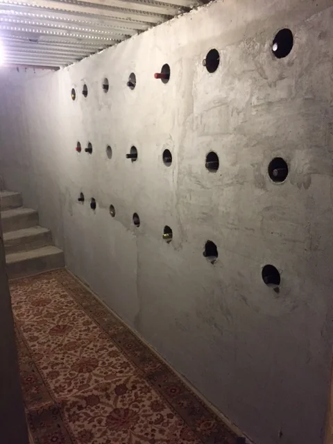 Plastic Sleeves placed in NUDURA wall create a feature wine wall