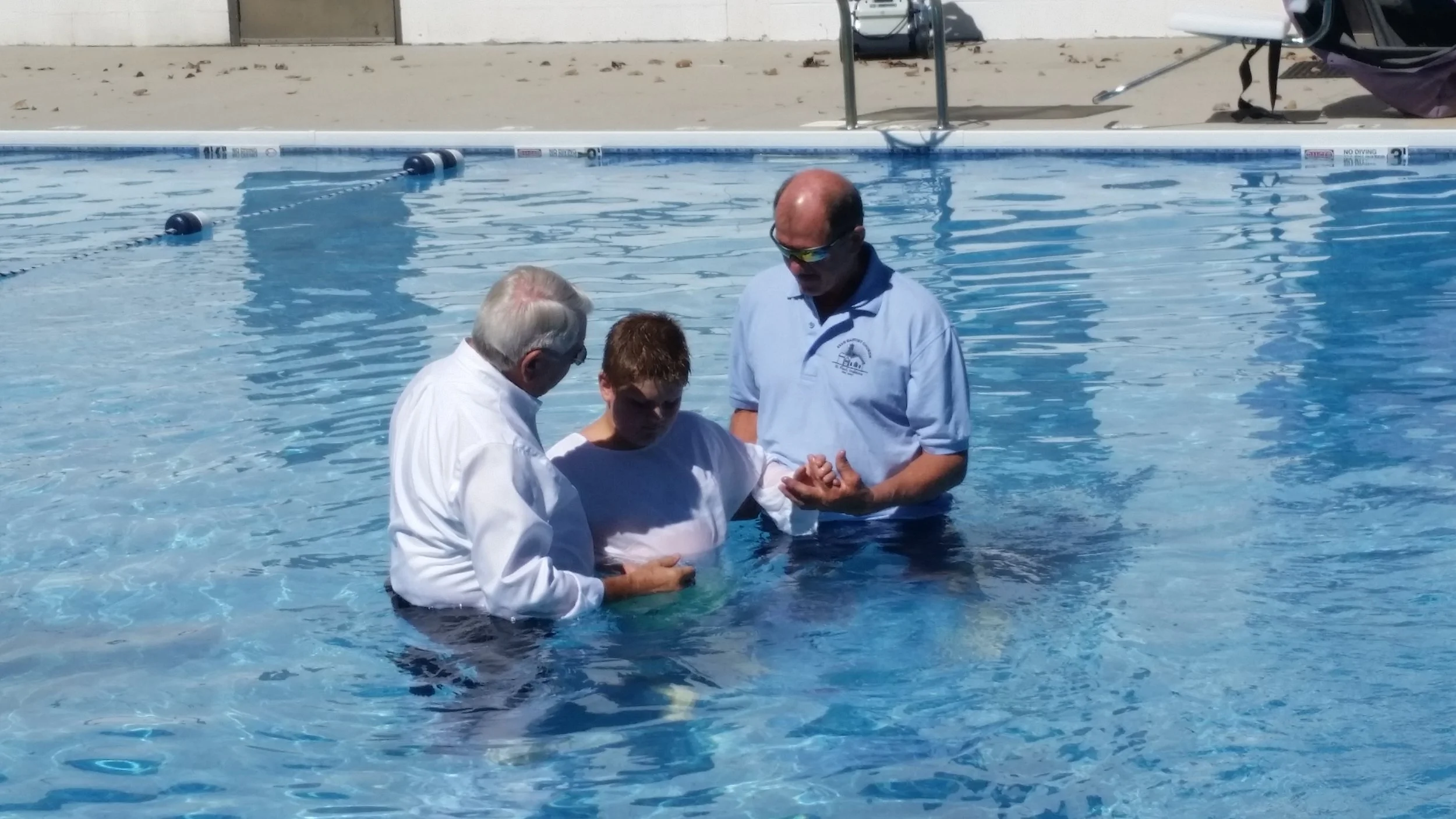 Baptisms of 2 new believers by Pastor Tom True of Star Baptist Church in the Pool at SBYCamp.