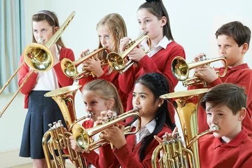Encourage your student to join band but also share the importance of continuing with private lessons where she can get personal attention.