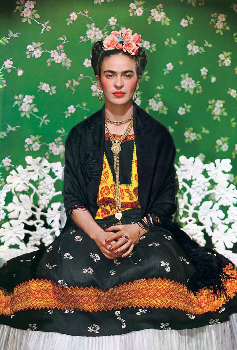 Nickolas Muray, American (Szeged, Hungary, 1892 – 1965, New York, New York), Frida Kahlo on White Bench, New York (2nd Edition), 1939, color carbon print, 19 x 14 ½ inches. Courtesy of Throckmorton Fine Art, New York, New York.
