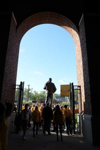The stadium gates are closed after the Hawkeyes arrive past the Nile Kinnick statue at Kinnick Stadium in Iowa City on Saturday, Sept. 17, 2016. (Liz Martin/The Gazette)