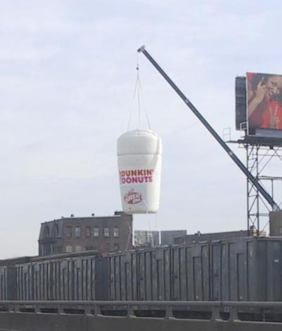advertising hanging from a crane