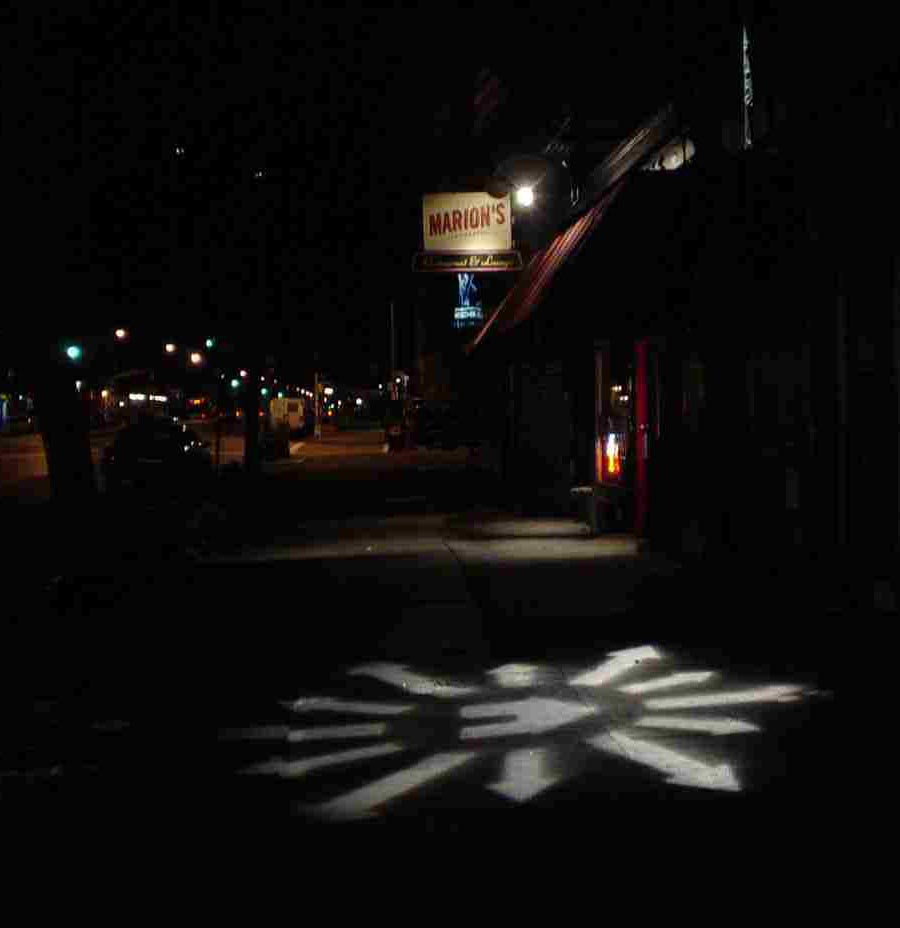 Bright spotlights on sidewalks 