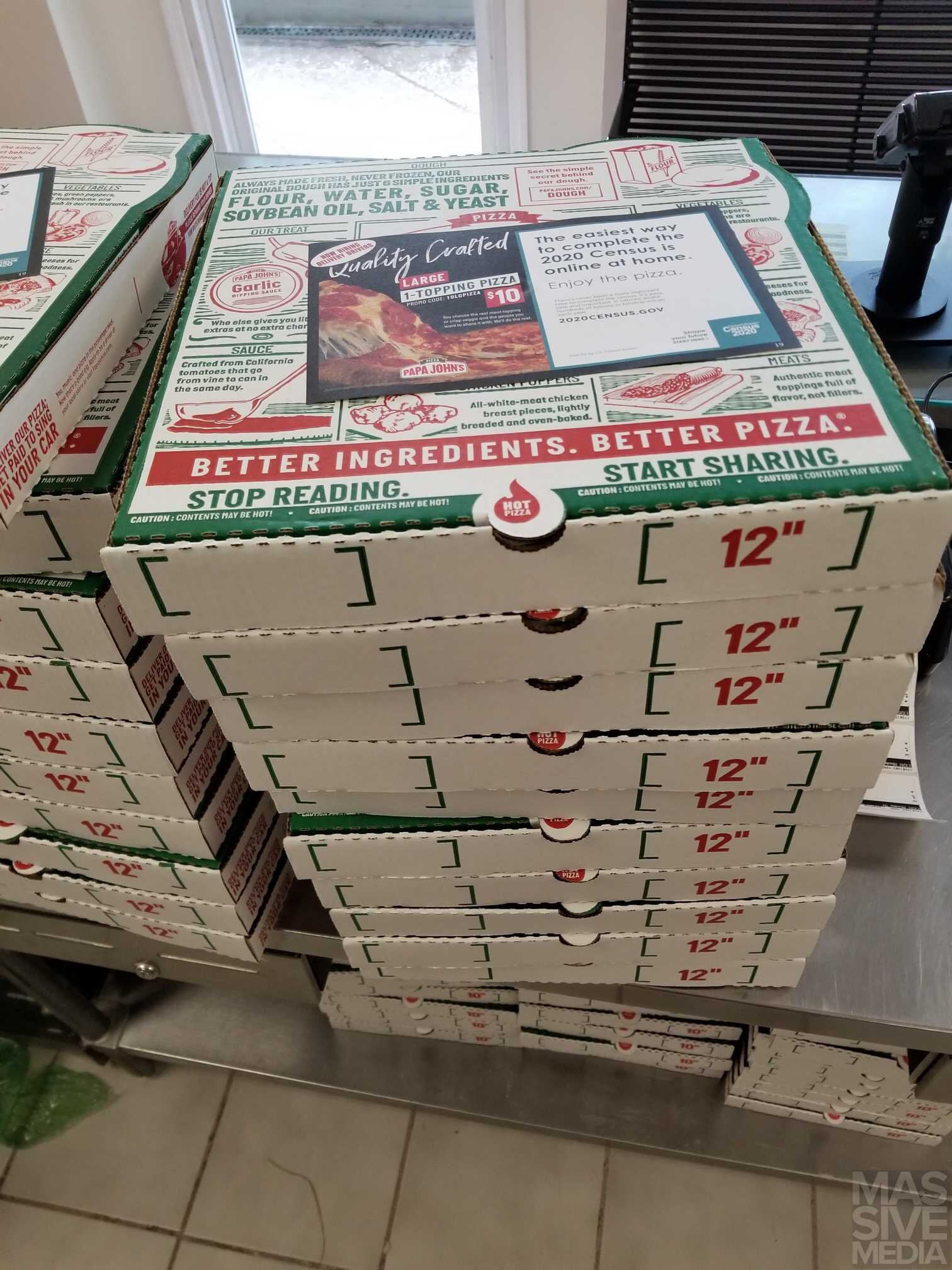 stack of pizza boxes with Advertising