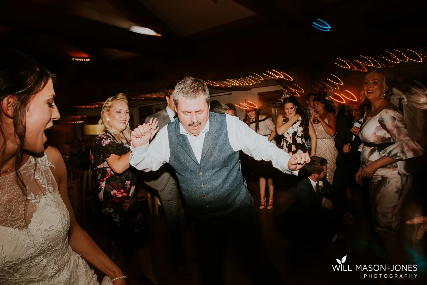  fun colourful and relaxed wedding dancefloor evening photography at king arthur hotel swansea 