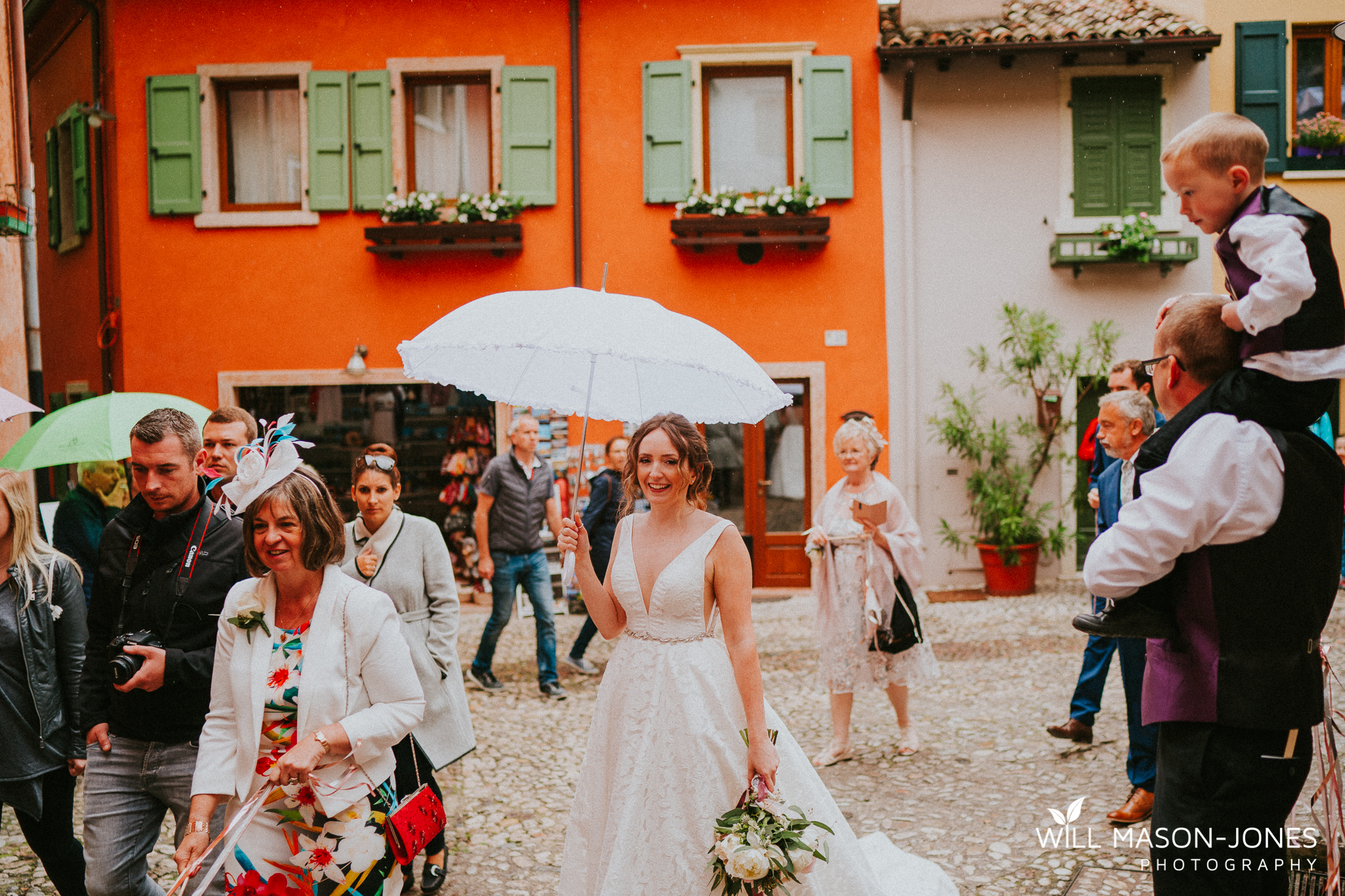  malcesine old town wedding guests candid natural photography lake garda 