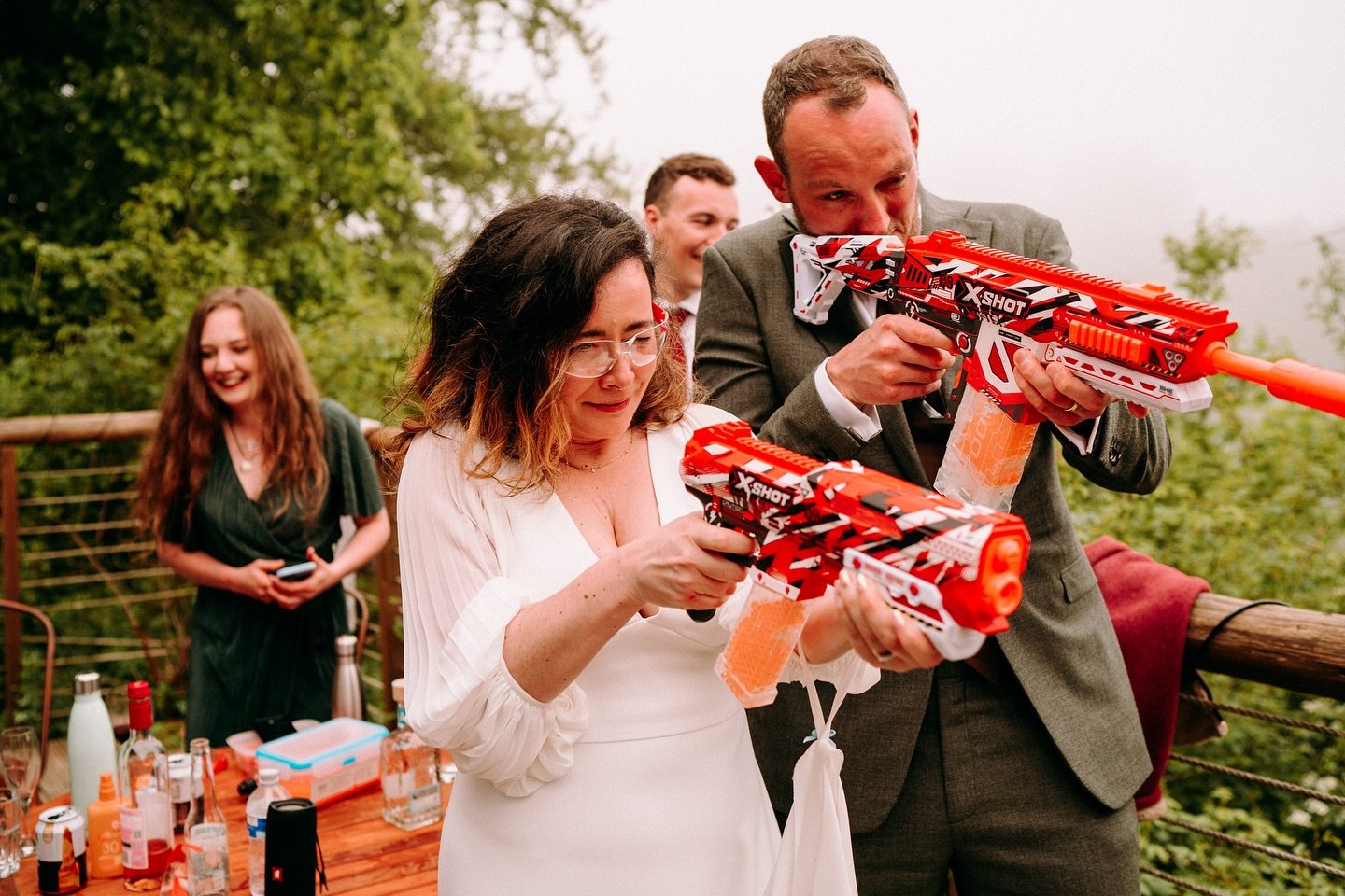 Who says weddings are just about the big moments? Kat &amp; Harry took a quick detour from the usual schedule to join their closest friends in an impromptu shoot-out&mdash;toy guns, empty beer cans, and a BBQ stand-in for the Wild West. 🤠🎯🔥

It&rs