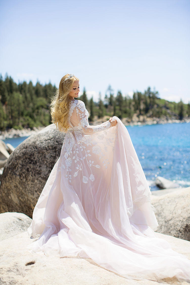Hayley isn't just one of our amazing designers, but an incredible friend as well! We've loved collaborating with her over the years, and could not wait to create something that fit Hayley's personal brand of whimsical glam! When you're one of the bridal fashion world's most unique and inventive designers, there's no reason not to have fun on your wedding day! Hayley sparkled in not one but three gorgeous gowns for her modern fairy tale wedding, starting with a gown fit for a princess for her traditional church ceremony. The flowing A-line gown with delicate embroidery called for something truly spectacular as the finishing touch - our custom designed Hayley tiara echoed the intricate patterns embellishing her show stopping dress, while the combination of White Opal and Clear Swarovski crystals perfectly echoed the grandeur of the gown.