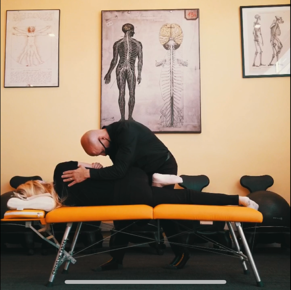 Dr. Jeremy Brook delivering a chiropractic adjustment