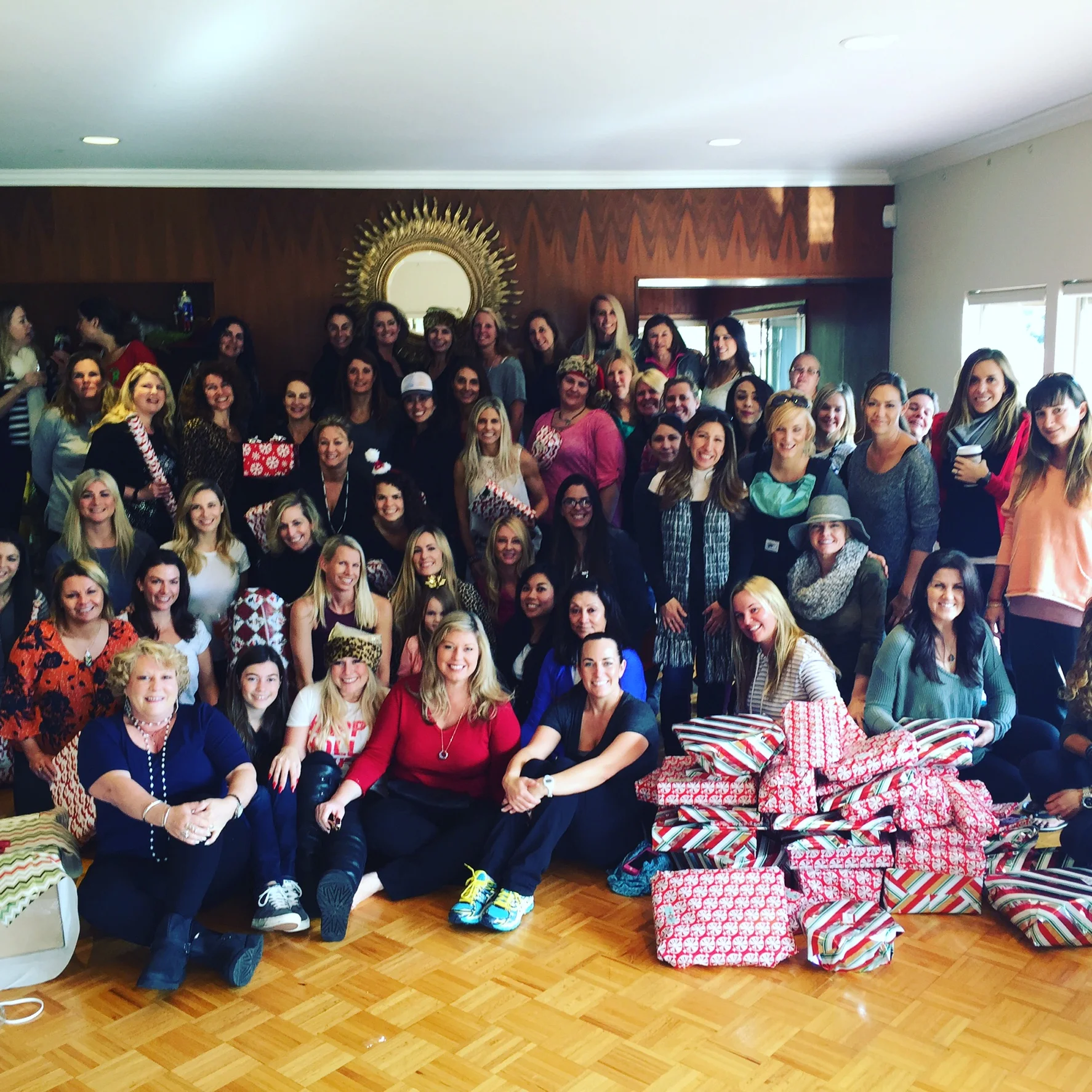 Ladies gather at the 2015 Holiday Gift Drive Wrap-a-Thon