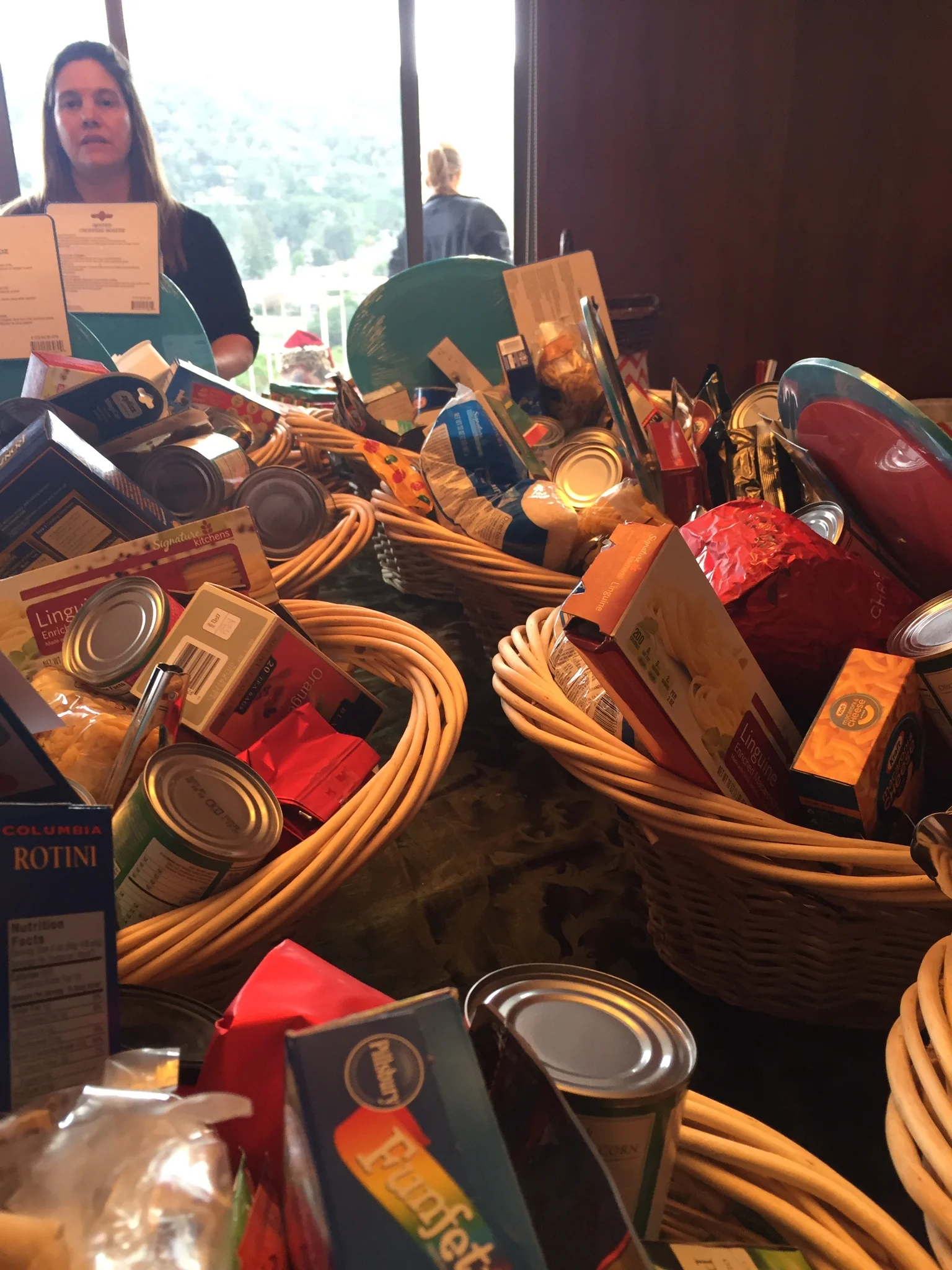 Each family receives a basket of non-perishable food, toiletries and other essentials