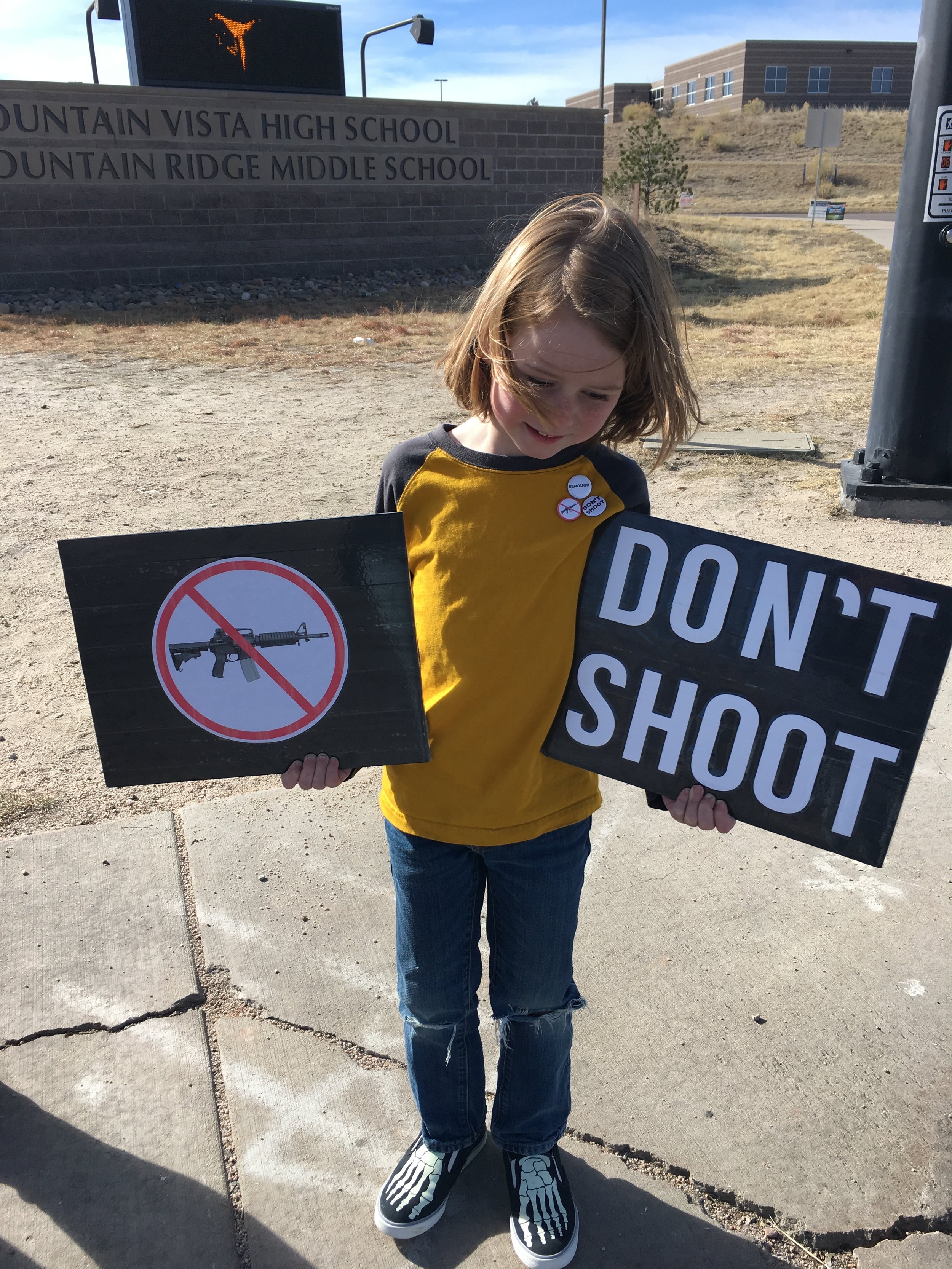  Conor Bolger, 8, stands outside Mountain Vista High School in Highlands Ranch, Colorado, on National School Walkout Day, March 14, 2018.&nbsp; 
