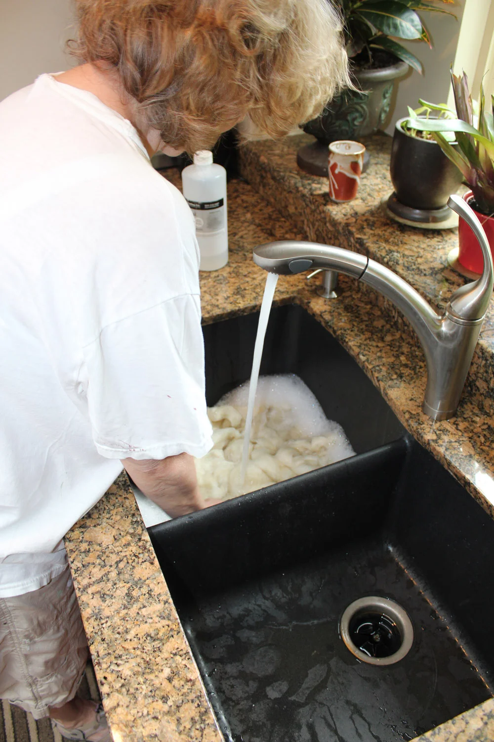 Washing the wool very gently.