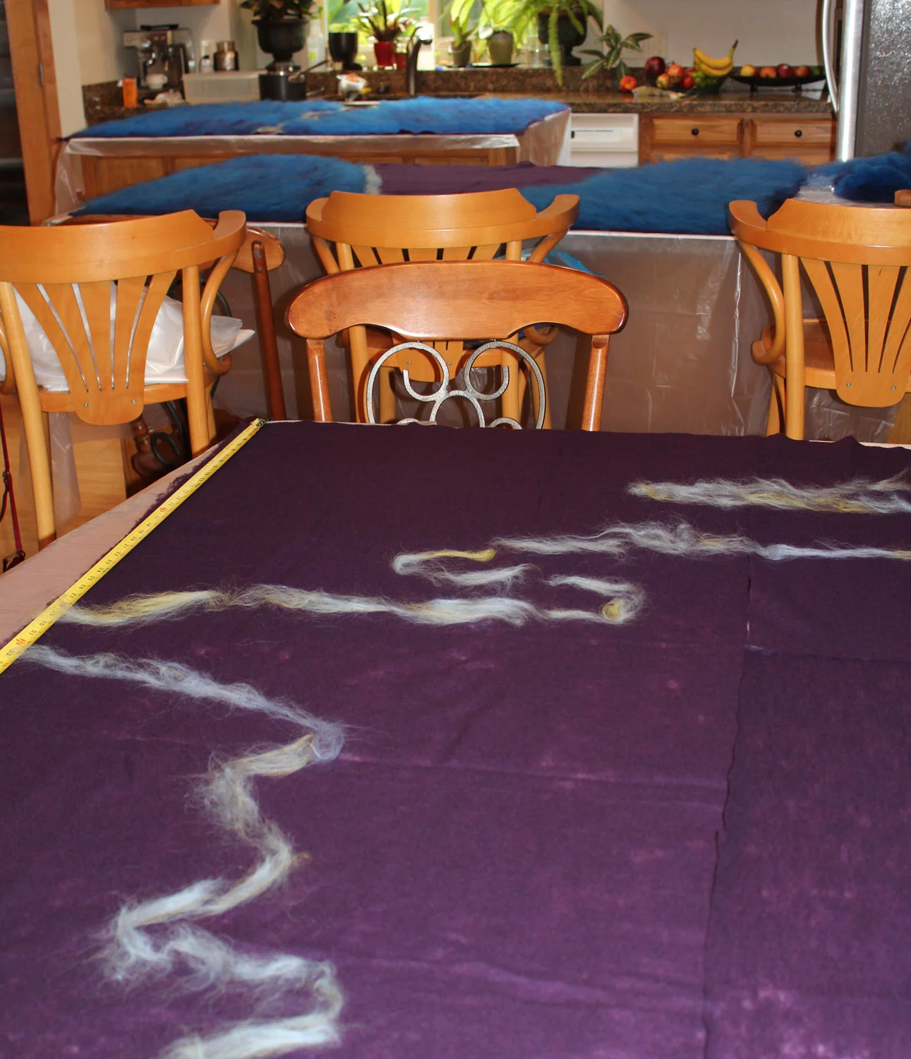 Drawing elements on the last painting. Note the start of filling in the base colors on the paintings at the top of the photo. 