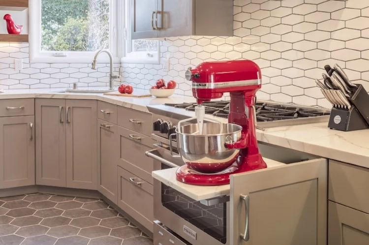 An appliance lift provides a handy storage solution for much-used & heavy kitchen appliances.
