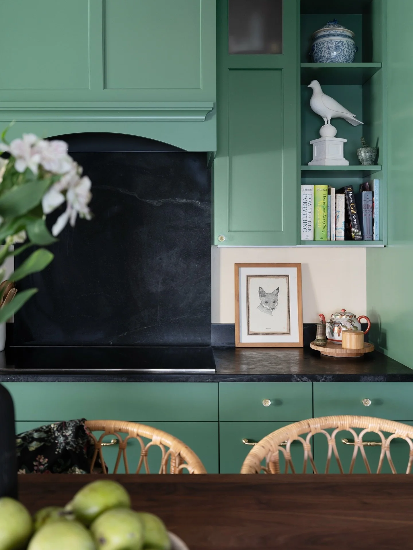 Rich green cabinets, black countertops, and a whole lot of character. This kitchen remodel proves that bold design can still feel effortlessly inviting, modern, moody, and full of personality!