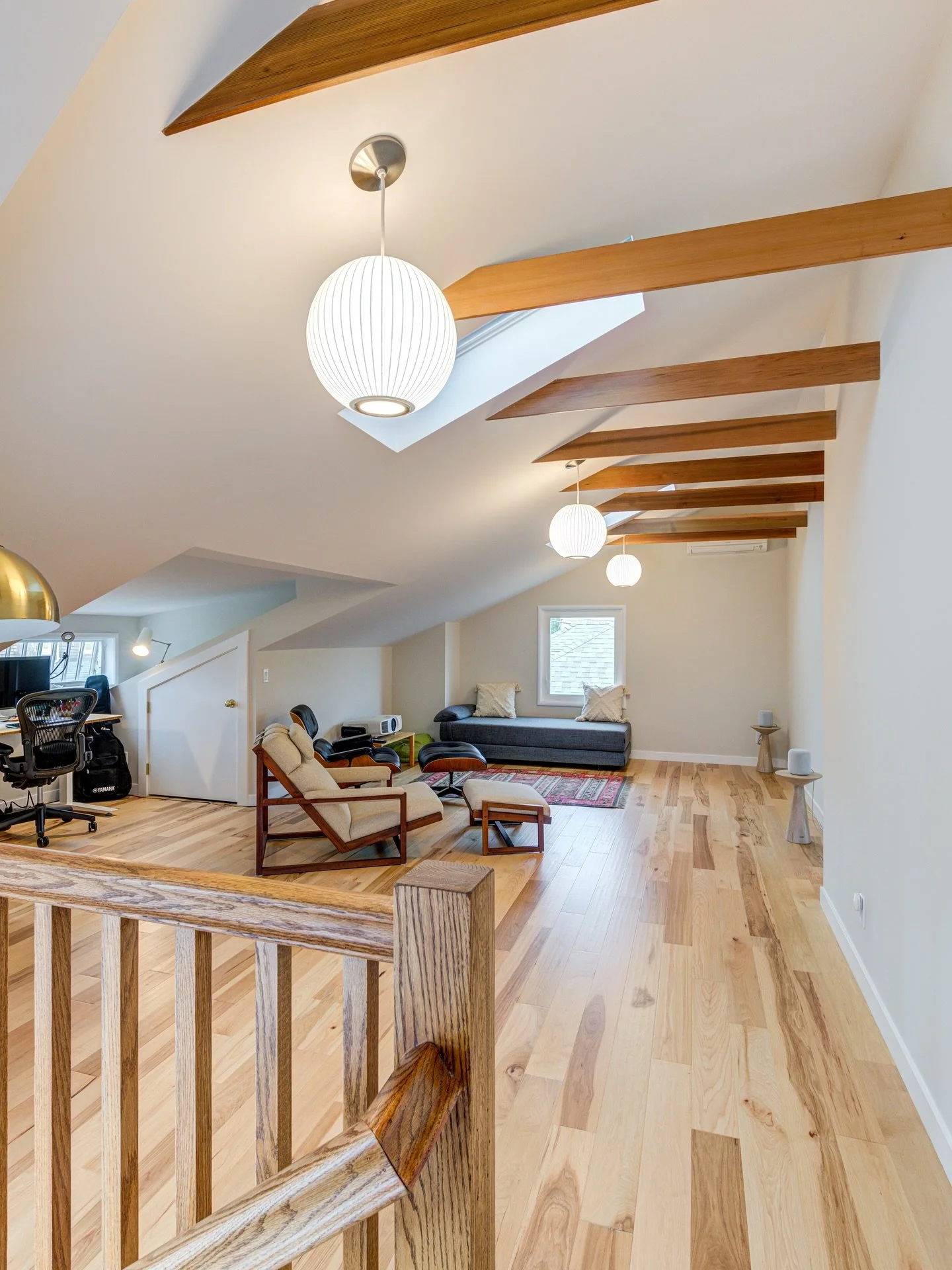 A space where skylit serenity meets exposed beams and sculpted architecture to create an elevated hideaway.