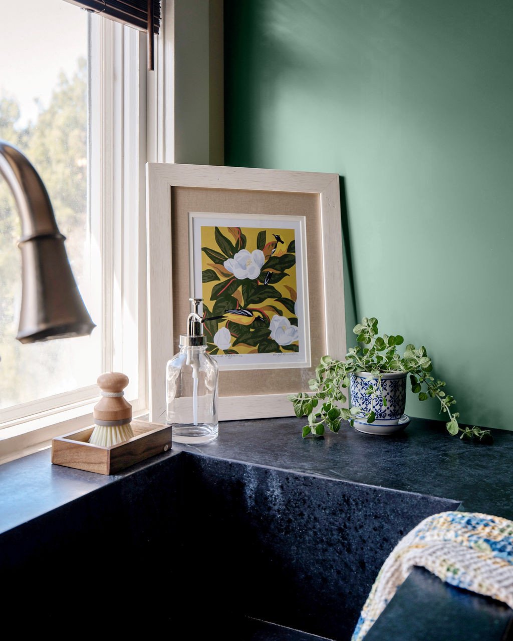 A closer look at a deep black soapstone sink, seamlessly matched to the countertops for a cohesive and quietly refined finish. 🖤