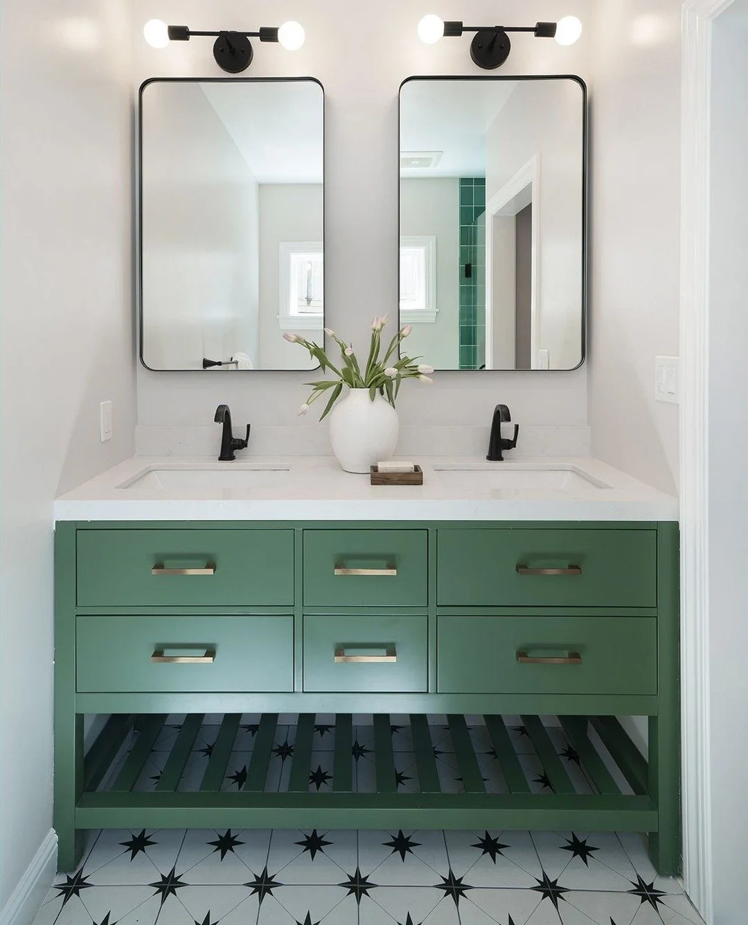 We love how the rich green cabinetry pairs with the graphic floor. A bold combination that brings personality and balance to this bathroom. 💚

#bathroom #bathroominspiration #bathroomremodel #modernbathroom #modernhomedecor #uniqueinteriors #uniqued