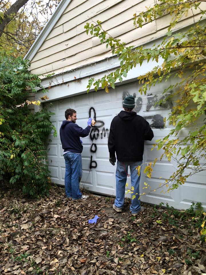 Cleaning up graffiti in our neighborhood.