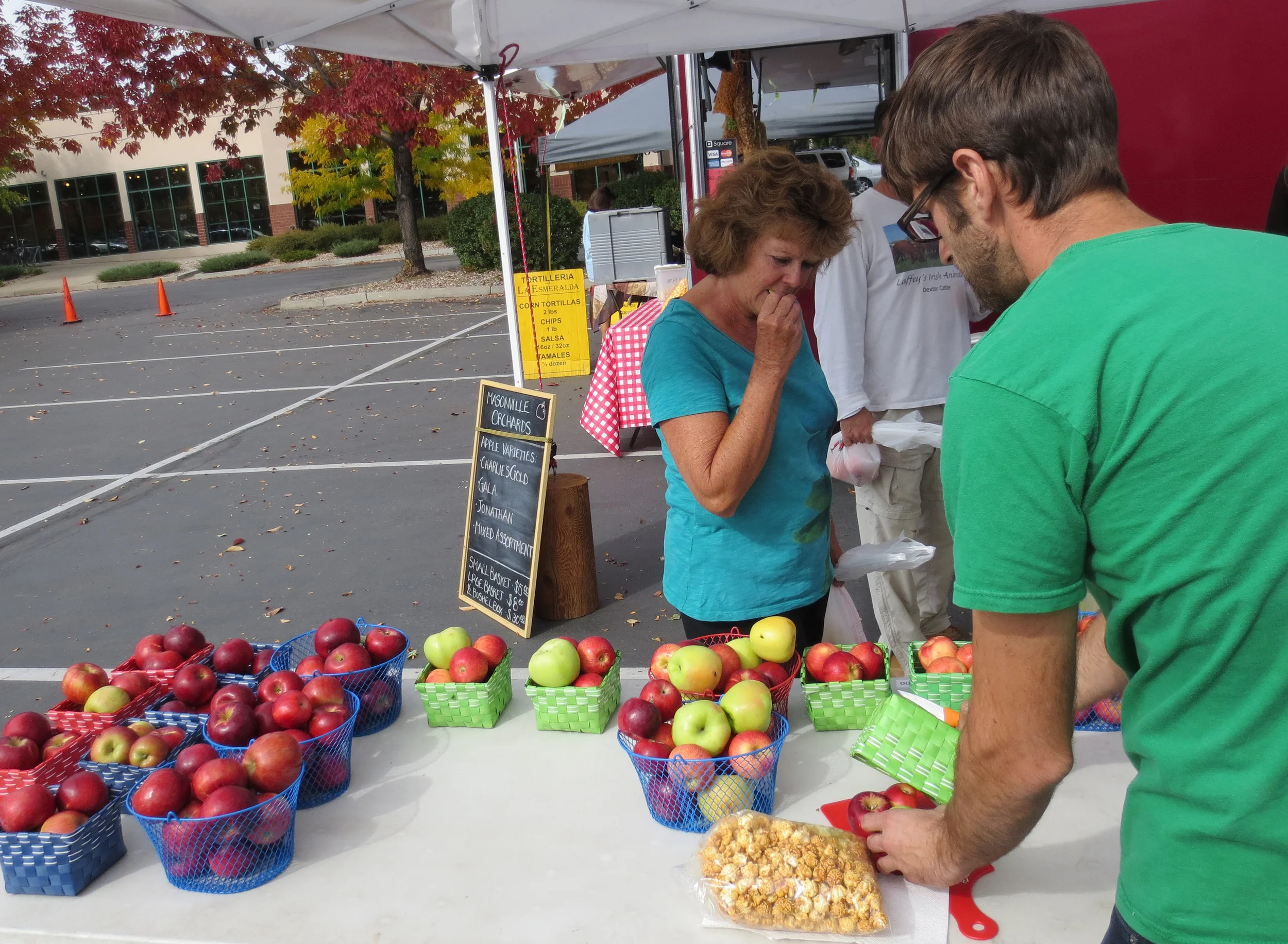  Sampling and conversations are key points for farmer's market attendees. 