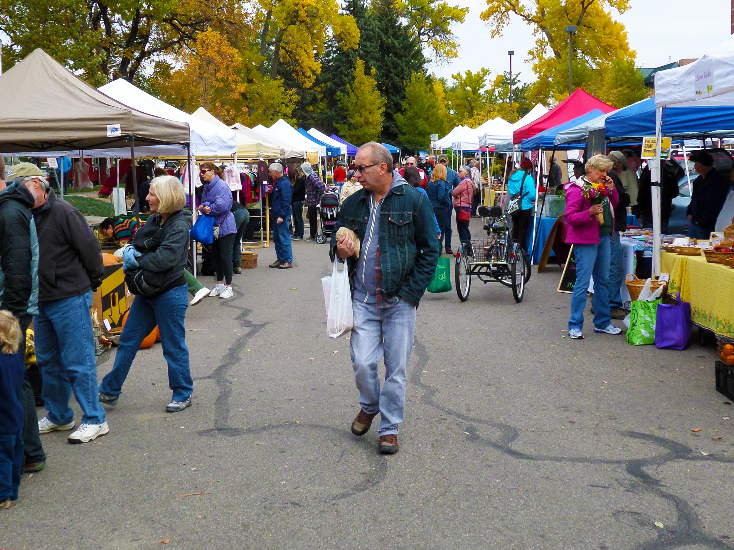  Locals stroll through the booths. 